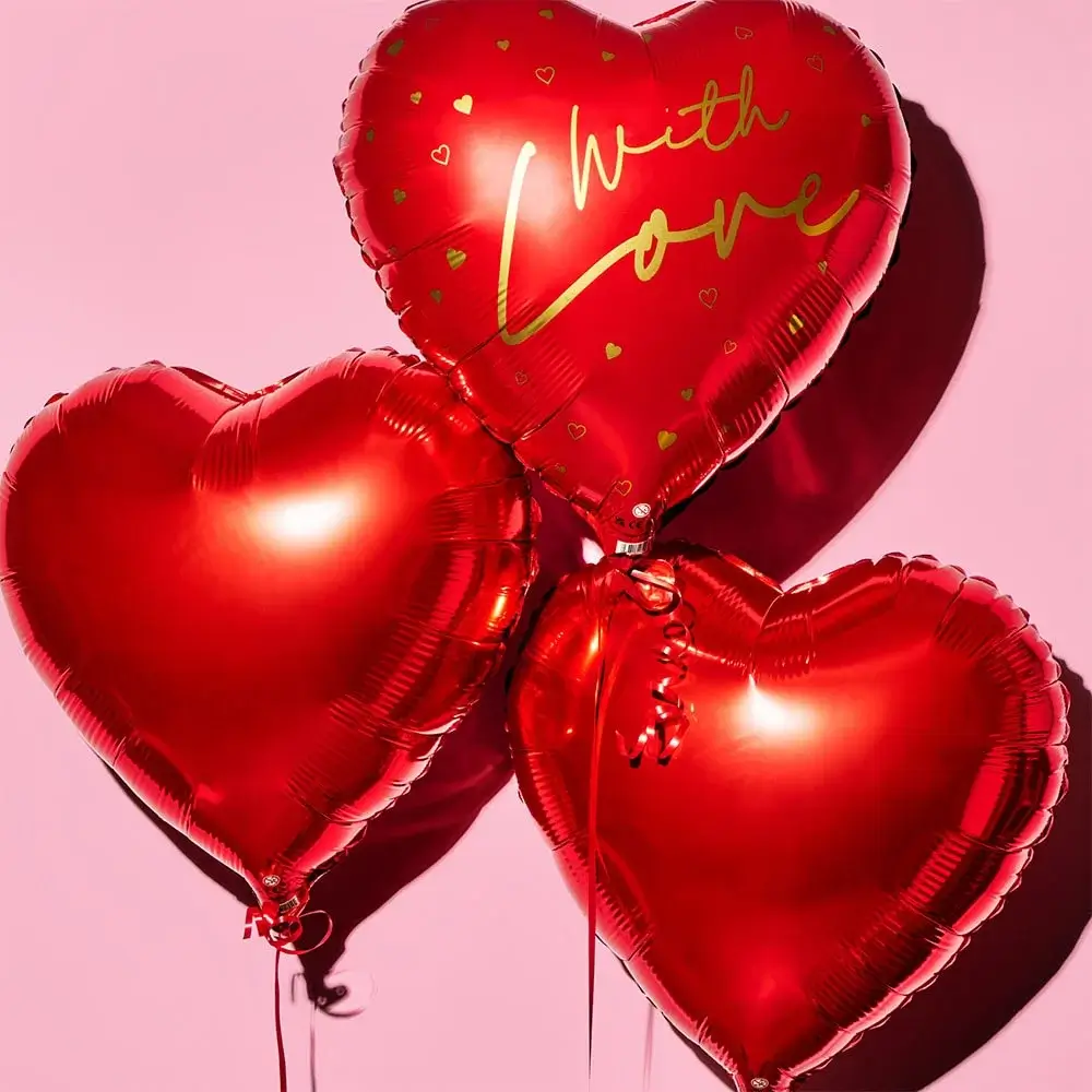 Three shiny red heart-shaped balloons against a pink background, with one balloon featuring the words With Love in gold lettering.